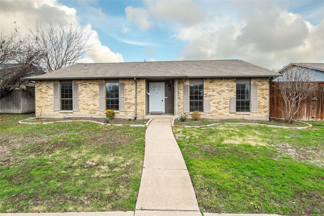 single story home with a front yard