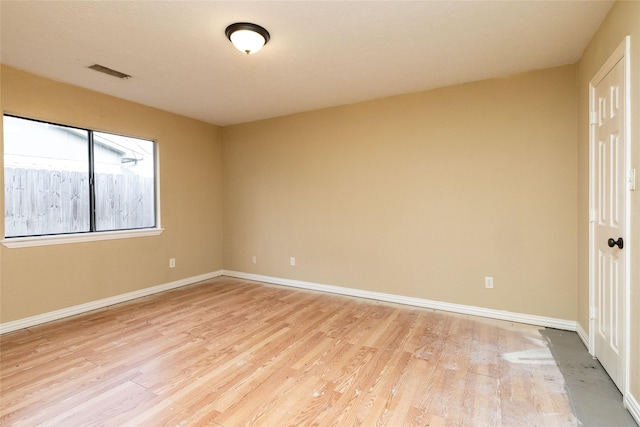 spare room with light wood-type flooring