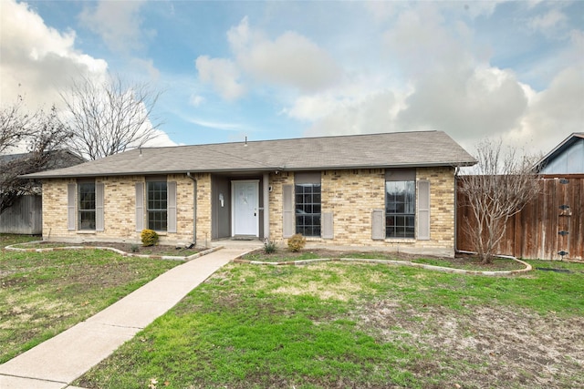 single story home featuring a front lawn