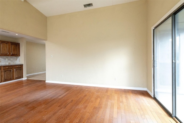 unfurnished living room with light hardwood / wood-style flooring