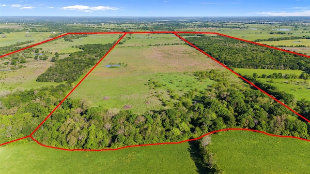 birds eye view of property featuring a rural view