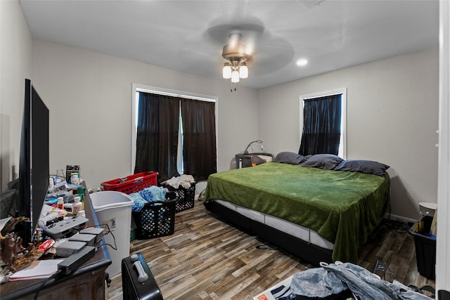 bedroom featuring wood-type flooring and ceiling fan