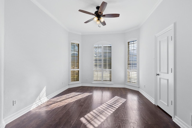 empty room featuring ceiling fan, ornamental molding, and dark hardwood / wood-style floors