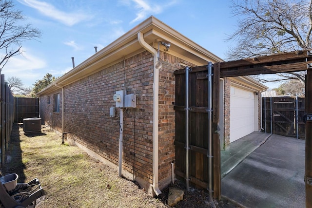 view of side of home with a garage