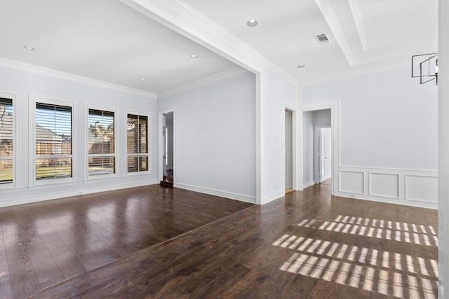 empty room featuring an inviting chandelier, crown molding, and dark hardwood / wood-style floors