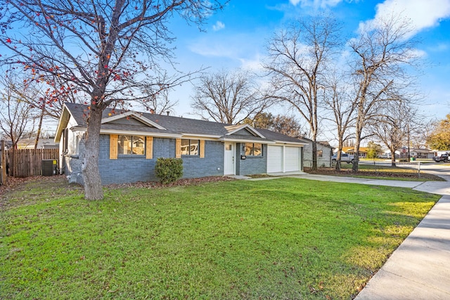 ranch-style house with central AC, a garage, and a front lawn