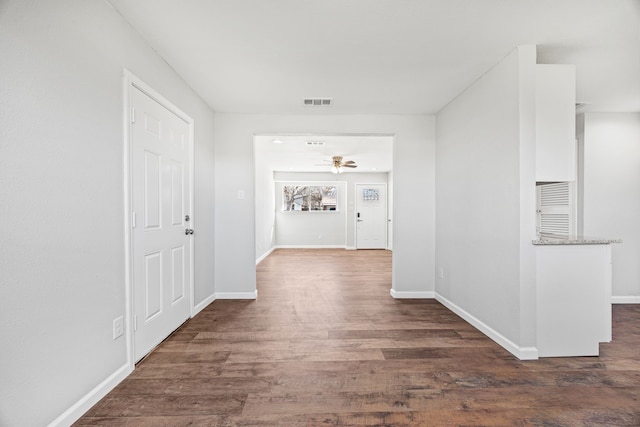 hall with dark wood-type flooring