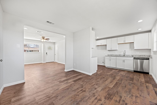 kitchen with white cabinets, dark hardwood / wood-style flooring, stainless steel dishwasher, and ceiling fan