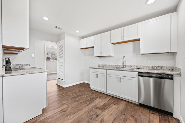 kitchen with dishwasher, white cabinets, and sink