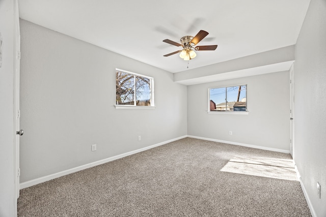 unfurnished room with carpet and ceiling fan