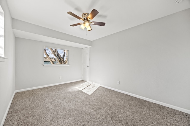 empty room featuring carpet and ceiling fan