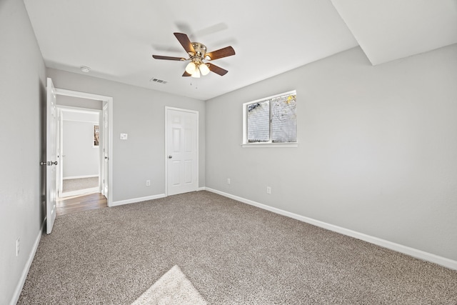 unfurnished bedroom with carpet floors and ceiling fan