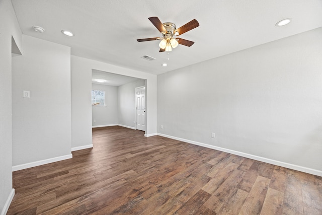 unfurnished room featuring dark hardwood / wood-style flooring and ceiling fan