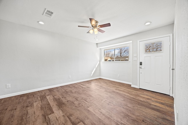 foyer featuring ceiling fan and dark wood-type flooring