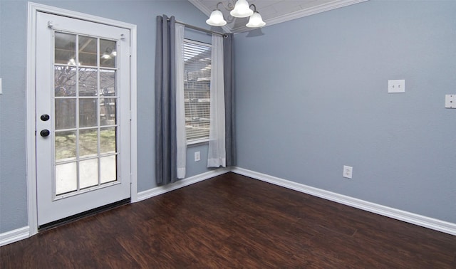 interior space featuring crown molding, dark wood-type flooring, and an inviting chandelier