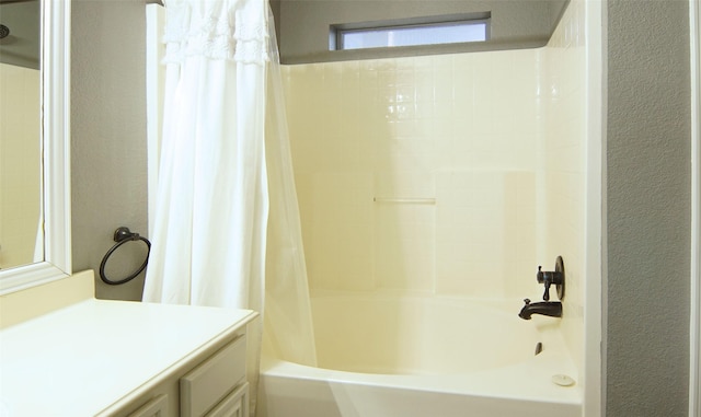 bathroom featuring vanity and shower / bath combo with shower curtain