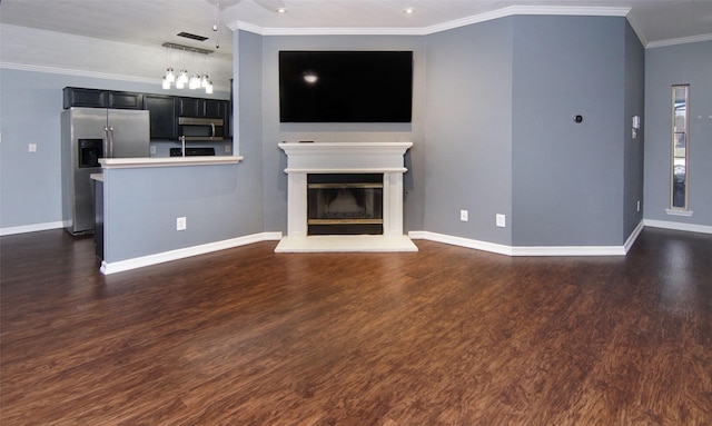 unfurnished living room with dark hardwood / wood-style floors and crown molding