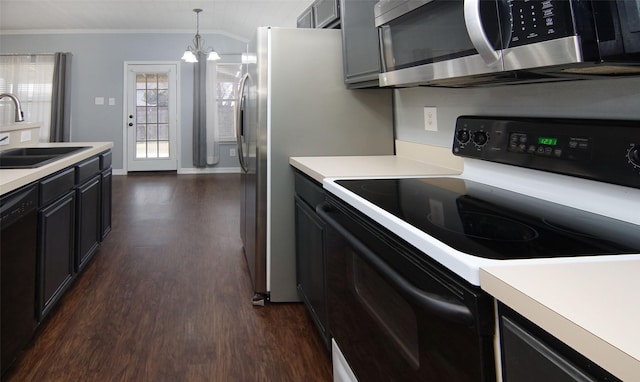 kitchen with black appliances, crown molding, sink, hanging light fixtures, and a notable chandelier