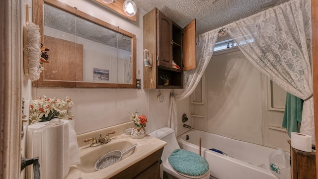 full bathroom with shower / bathing tub combination, vanity, toilet, and a textured ceiling