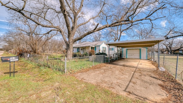 ranch-style house with a garage and a carport