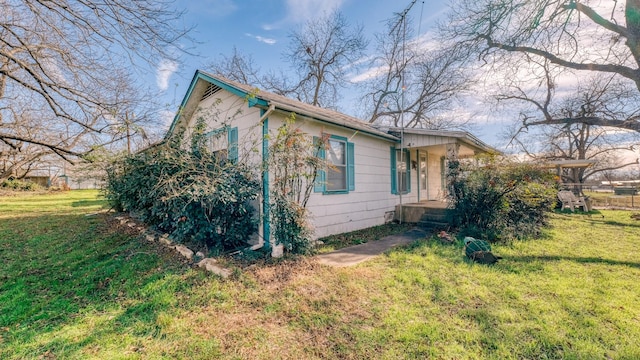 view of home's exterior featuring a yard