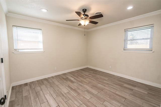 empty room featuring light hardwood / wood-style flooring, ceiling fan, and ornamental molding