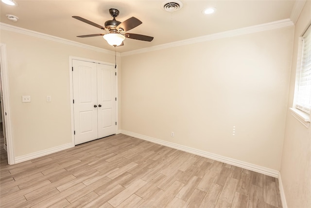 unfurnished bedroom with ceiling fan, ornamental molding, and light hardwood / wood-style flooring