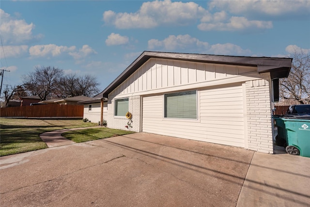 view of side of property with a yard