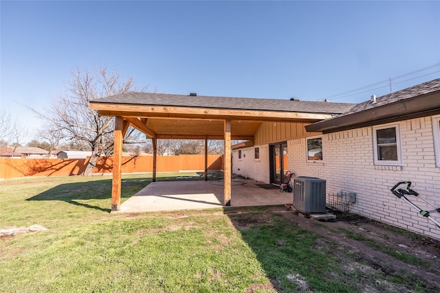 view of yard with central AC and a patio area