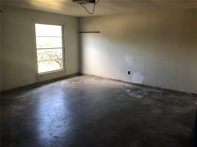 spare room with concrete floors