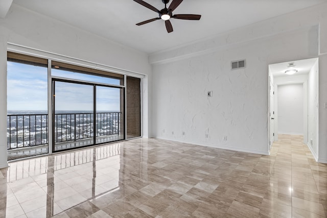 unfurnished room with ceiling fan