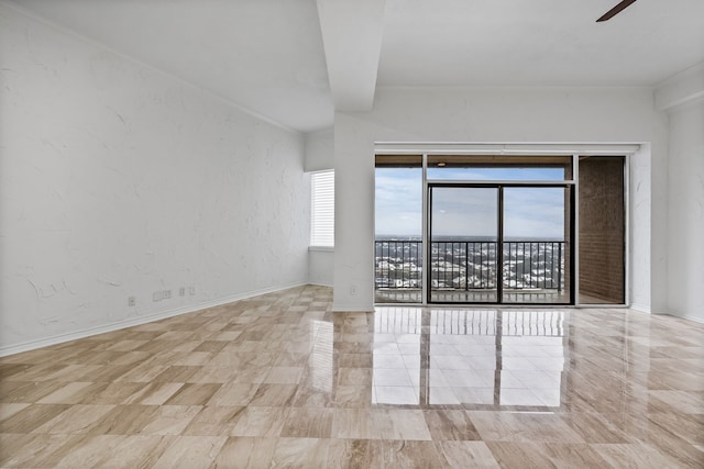 unfurnished room with ceiling fan