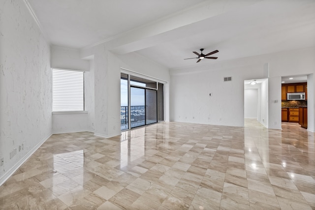 spare room with ceiling fan and crown molding