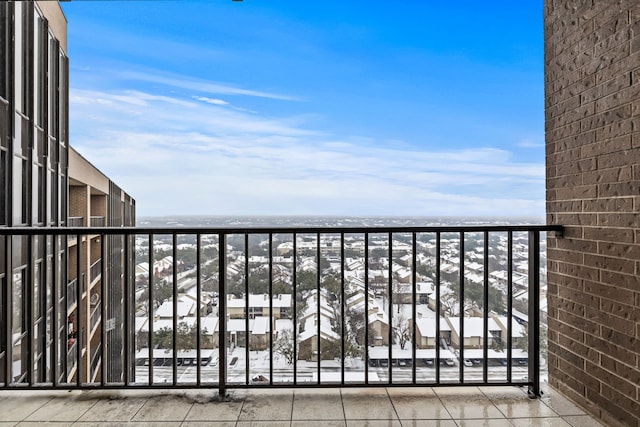 view of snow covered back of property