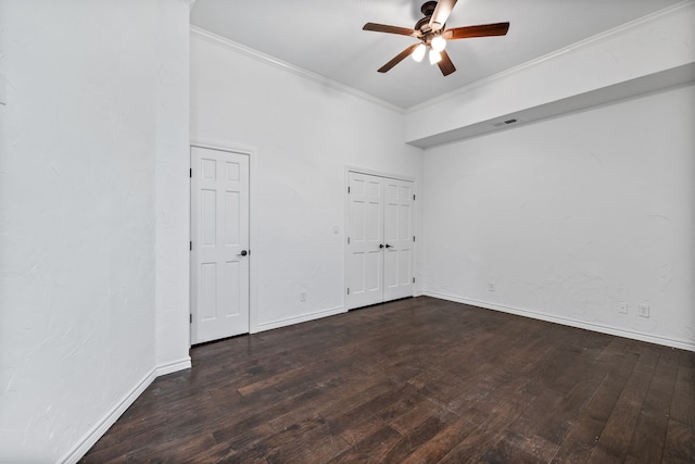 unfurnished room with dark hardwood / wood-style flooring, ceiling fan, and ornamental molding