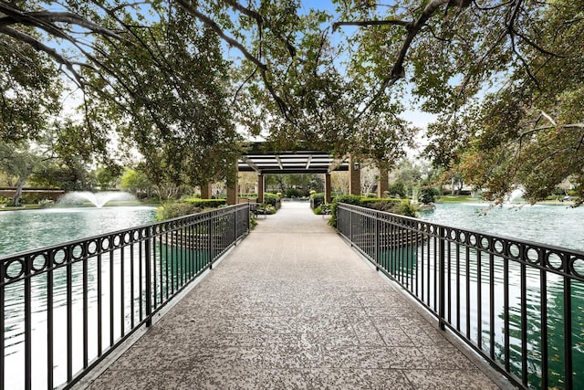 surrounding community featuring a water view