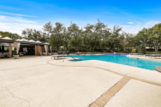 view of swimming pool with a patio area