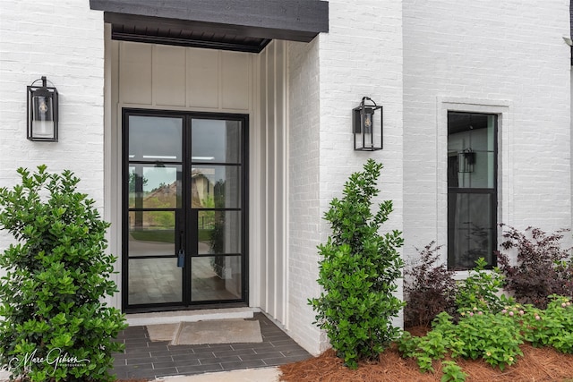 view of exterior entry featuring french doors