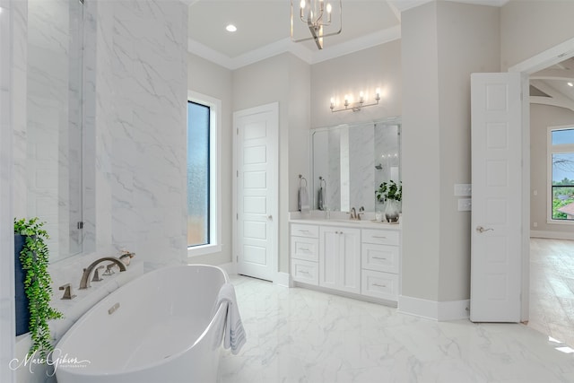 full bath featuring marble finish floor, ornamental molding, baseboards, a soaking tub, and vanity