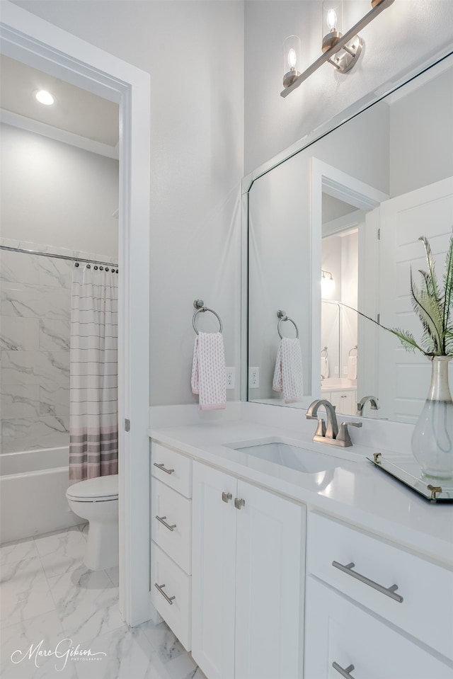 bathroom featuring toilet, marble finish floor, shower / tub combo with curtain, and vanity