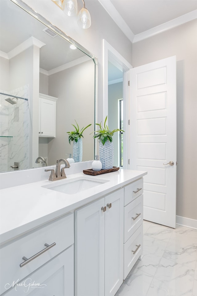 bathroom with crown molding, vanity, and walk in shower