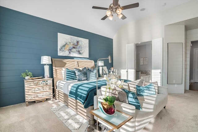 bedroom with ceiling fan, lofted ceiling, and light carpet