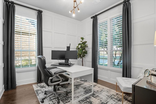 office space with dark wood-type flooring and an inviting chandelier