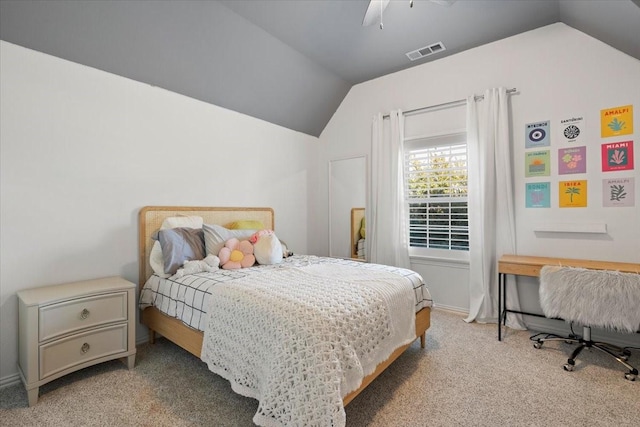 carpeted bedroom with ceiling fan and lofted ceiling