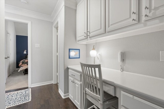 office space featuring dark hardwood / wood-style floors and crown molding