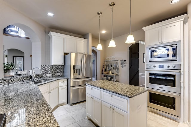 kitchen with white cabinetry, sink, and appliances with stainless steel finishes