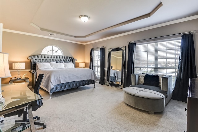 bedroom featuring carpet flooring, a raised ceiling, ornamental molding, and multiple windows