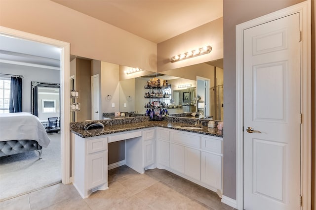 bathroom featuring tile patterned flooring and vanity