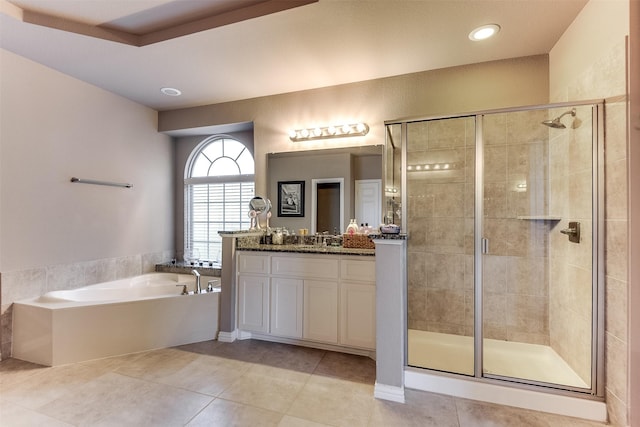 bathroom featuring tile patterned flooring, vanity, and independent shower and bath