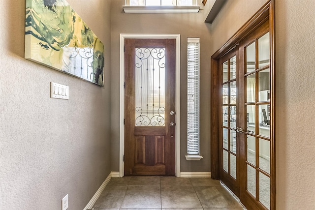 tiled entrance foyer with french doors